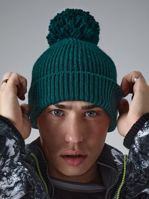 Engineered knit ribbed pom pom beanie